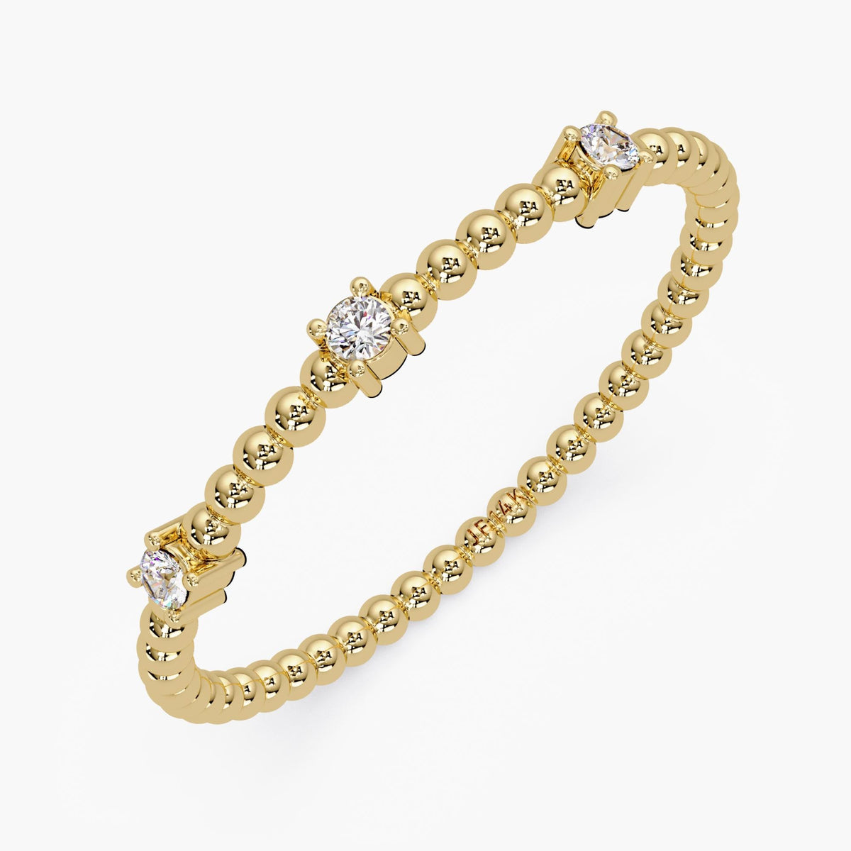 14K yellow gold beaded ring with three diamonds: a 2mm round diamond in the center and two smaller diamonds on each side, set in four-prong settings.