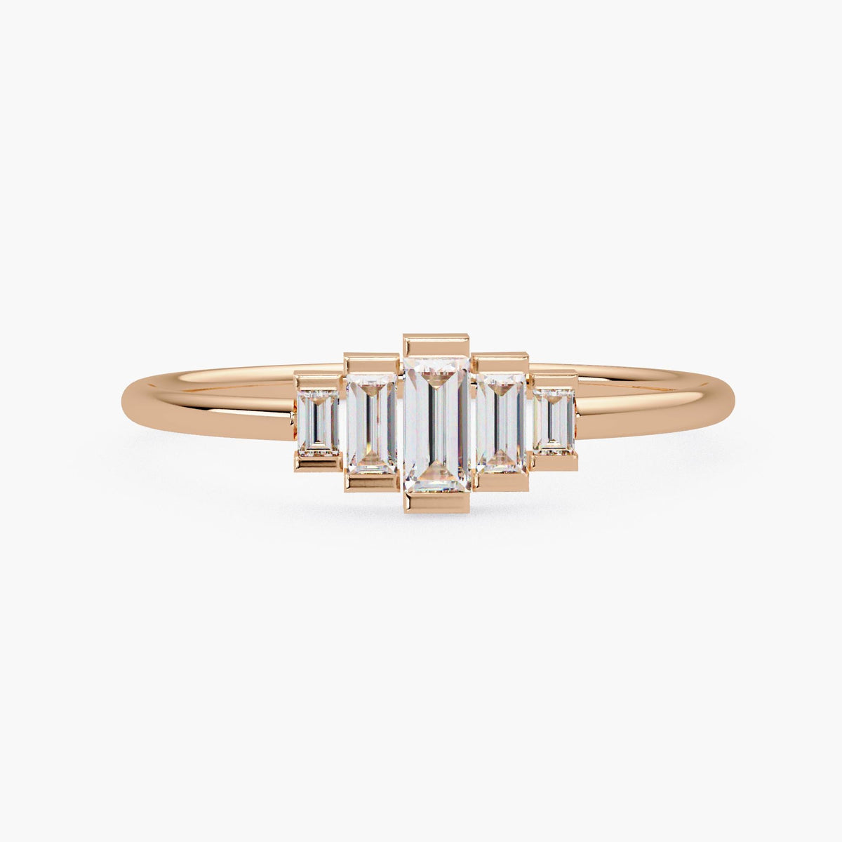 Front view of a 14k rose gold ring featuring five baguette-cut lab grown diamonds in a stepped half bezel setting with a clean Art Deco-inspired layout.