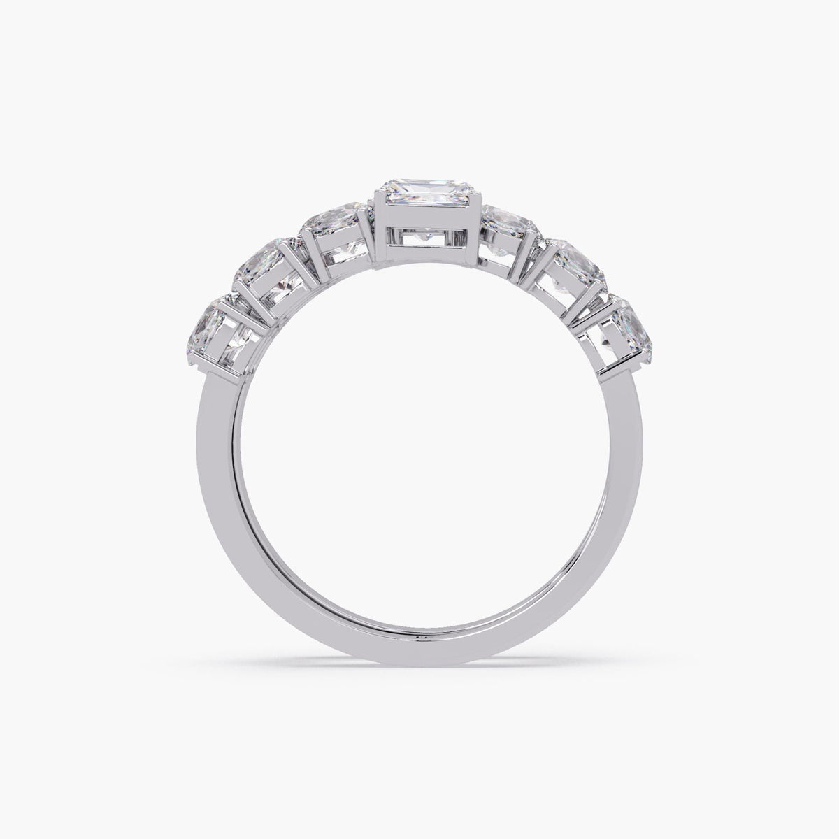 14K white gold spiral wrap ring, highlighting the elevated prong settings of oval diamonds along the curved band and the open gallery beneath the emerald cut center stones.