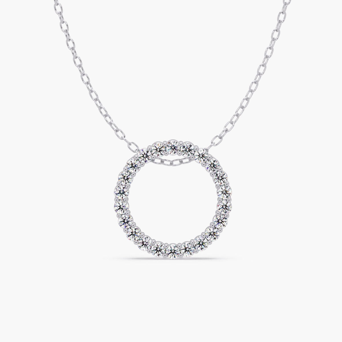 14k white gold open circle pendant with natural round diamonds in a full eternity design, shown on a fine cable chain.