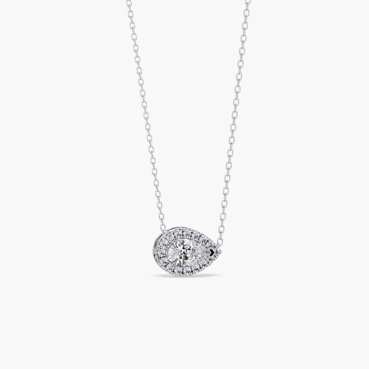 14k white gold pear diamond pendant with a 1ct lab grown pear-shaped center diamond surrounded by a halo of round diamonds in an east west setting.