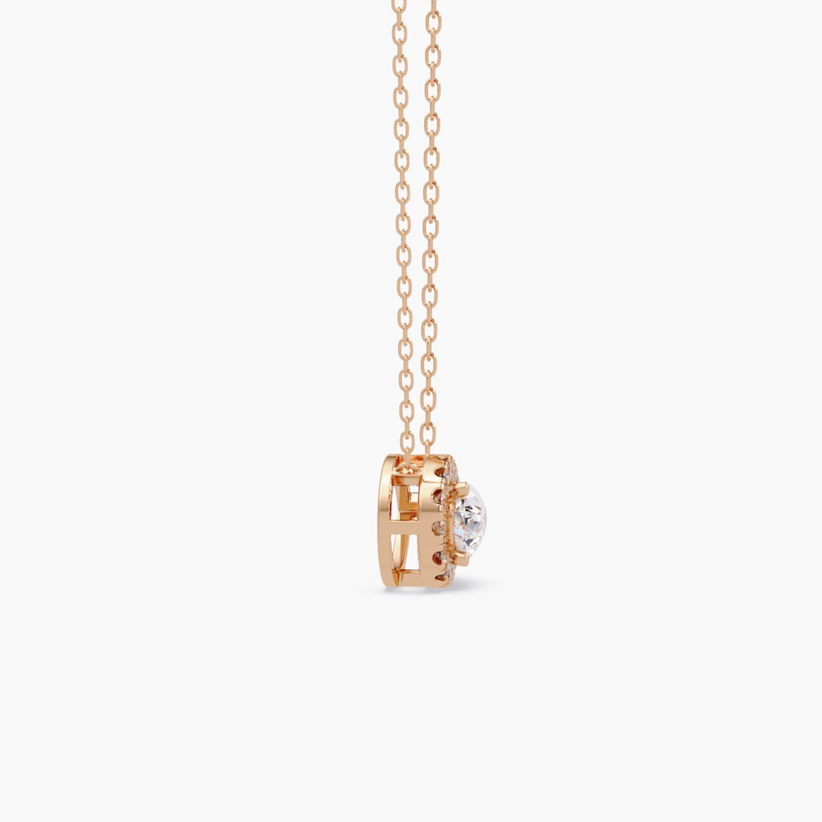 14k rose gold pear diamond pendant with a 1ct lab grown pear-shaped center diamond surrounded by a halo of round diamonds in an east west setting.