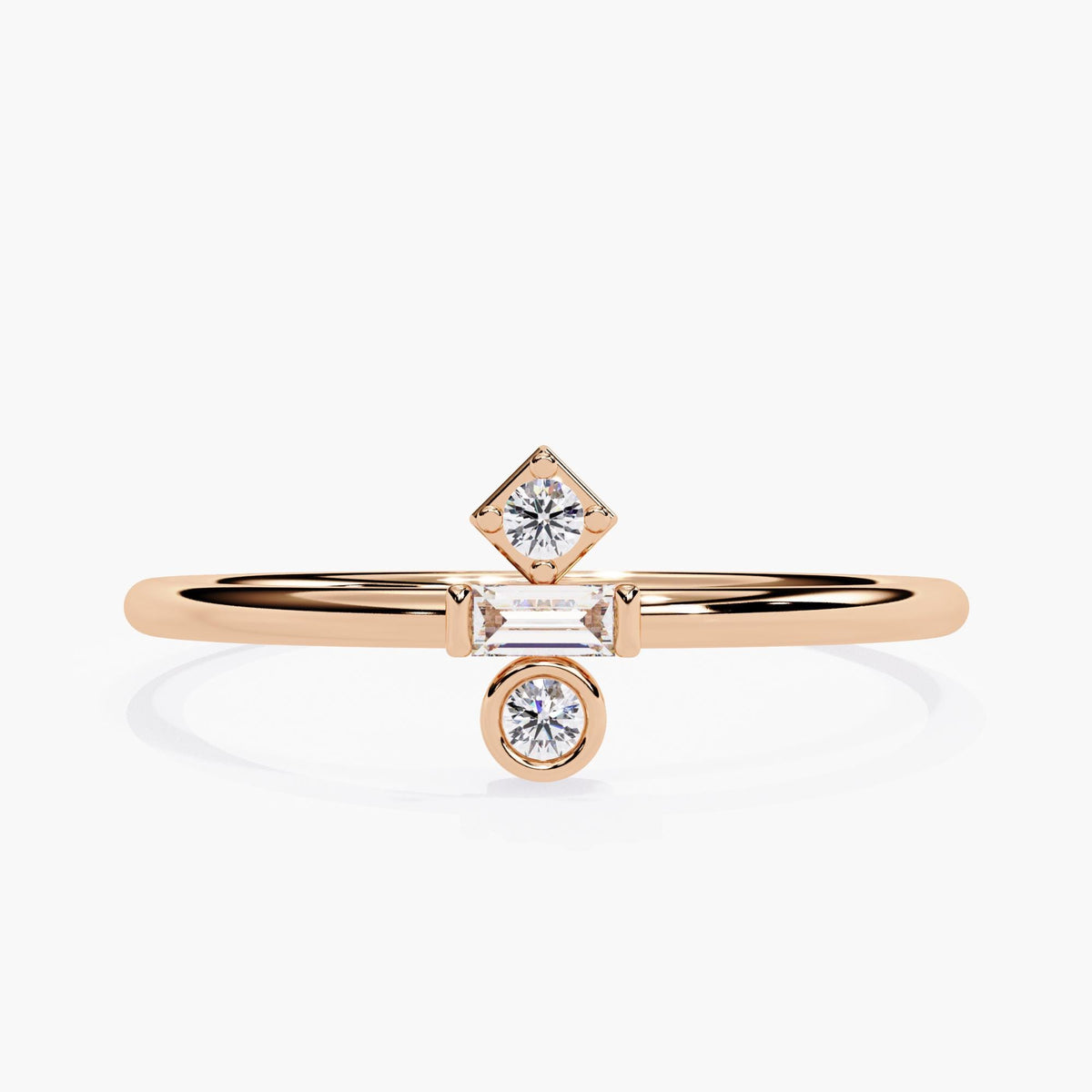Front view of a 14k rose gold ring featuring three lab-grown diamonds arranged in a geometric layout. A prong-set round diamond sits in a square frame above a horizontal baguette diamond and a bezel-set round diamond below. The warm rose tone and clean design make this a soft, modern piece for stacking or minimalist daily wear.
