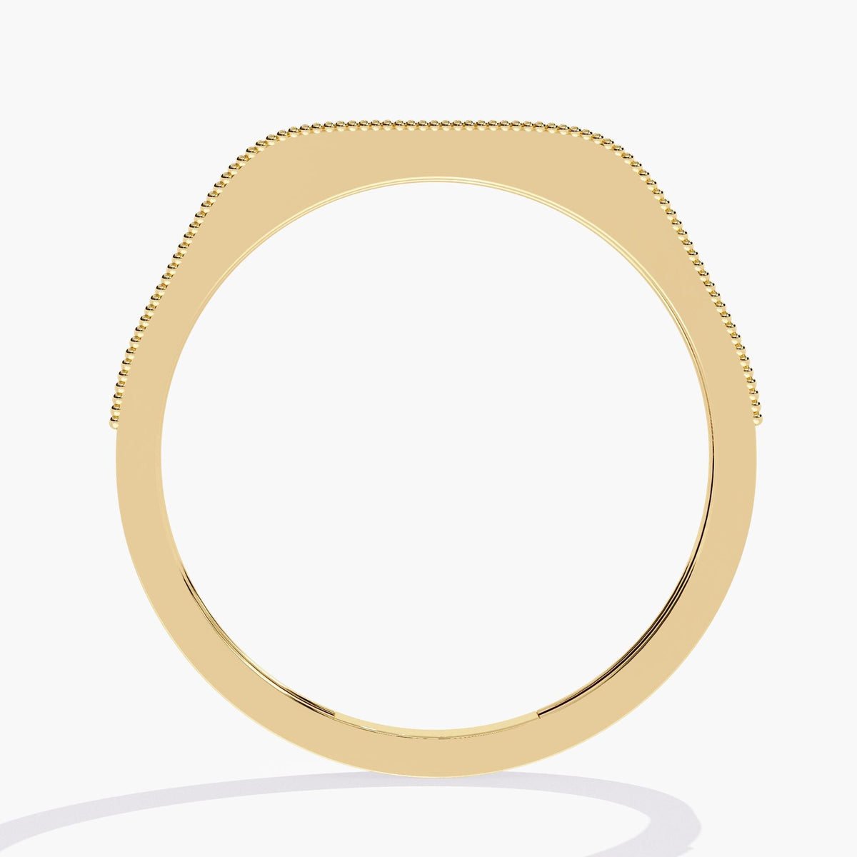 Side profile of a 14k yellow gold ring with a flat top and beaded milgrain edges, showing the squared silhouette from the side.