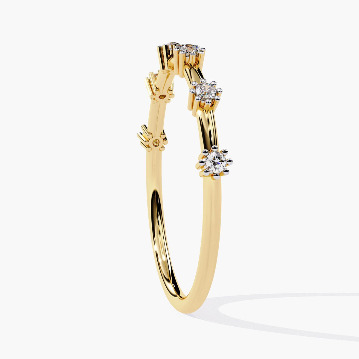 Side view of a 14k yellow gold ultra-thin band featuring six spaced round natural diamonds in claw prong settings. The elevated prongs create a floating diamond look, highlighting the minimal and airy design of this half eternity ring.