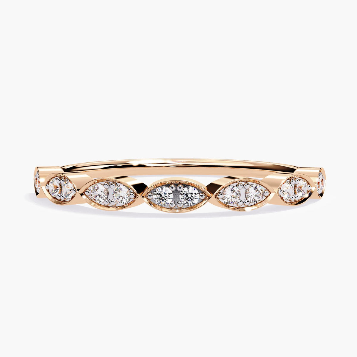 A rose gold band featuring alternating marquise-shaped settings with round diamonds, each set in a bezel design. The diamonds are arranged in an elegant pattern along the band, creating a sophisticated and timeless look. This half eternity ring combines the warmth of rose gold with the sparkle of diamonds, making it an ideal choice for an engagement band, promise ring, or anniversary gift.