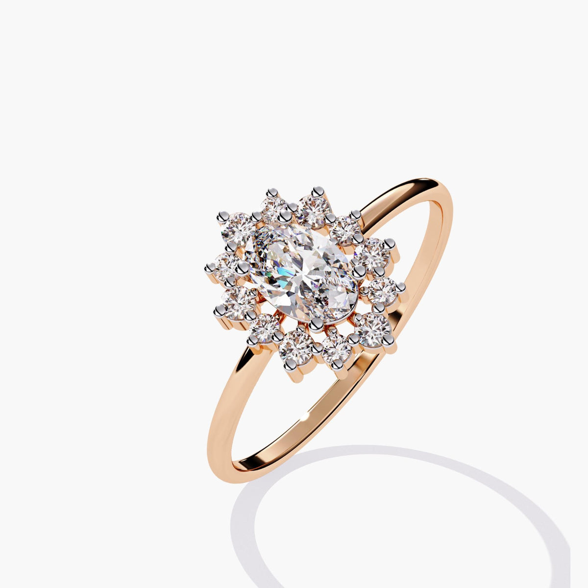 14K rose gold ring showcasing a 0.5 carat oval lab-grown diamond surrounded by a starburst-style floral halo of round diamonds. Set on a slim, polished band with warm pink undertones.