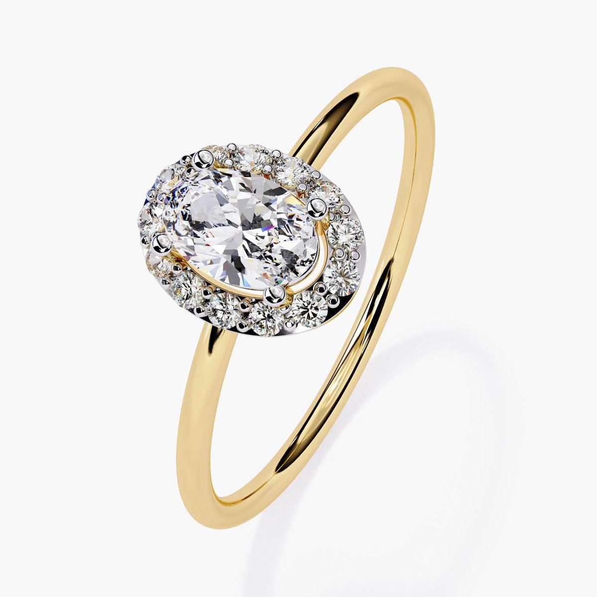 A 14k yellow gold engagement ring featuring a 0.35 ct oval lab-grown diamond at the center, surrounded by a halo of small round diamonds in a prong setting. The ris has a raised center and slim 1.3mm band with a bright polished finish.