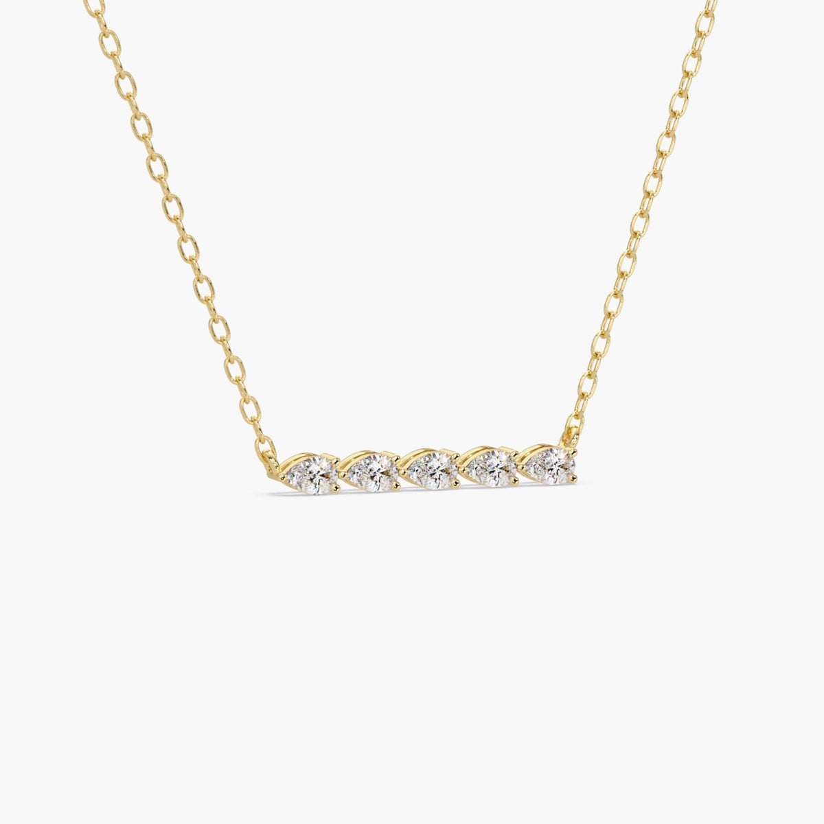 14k yellow gold necklace with five pear-shaped lab-grown diamonds arranged in a horizontal bar. The diamonds are set close together and attached to a delicate gold chain.