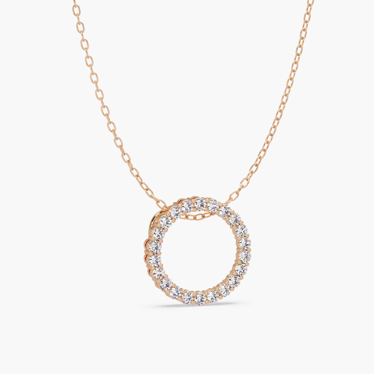 14k rose gold open circle pendant featuring natural round diamonds in a full eternity design, shown on a fine cable chain.