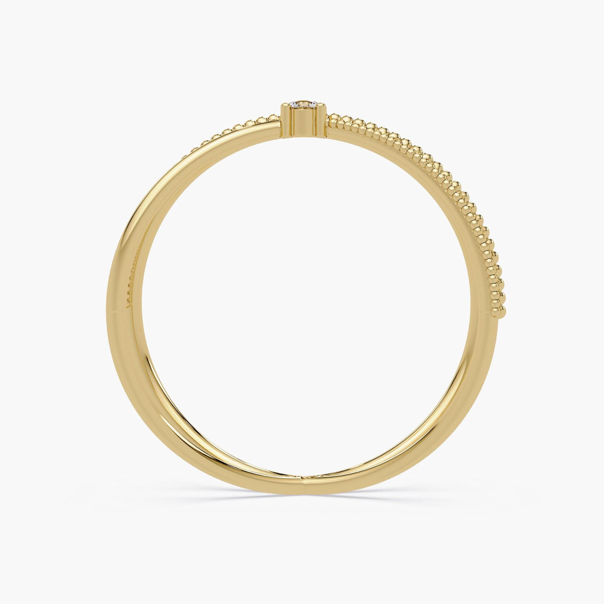 14k solid gold criss cross ring featuring a round natural diamond at the center, with one polished band crossing over a beaded gold band in an X-ring design.