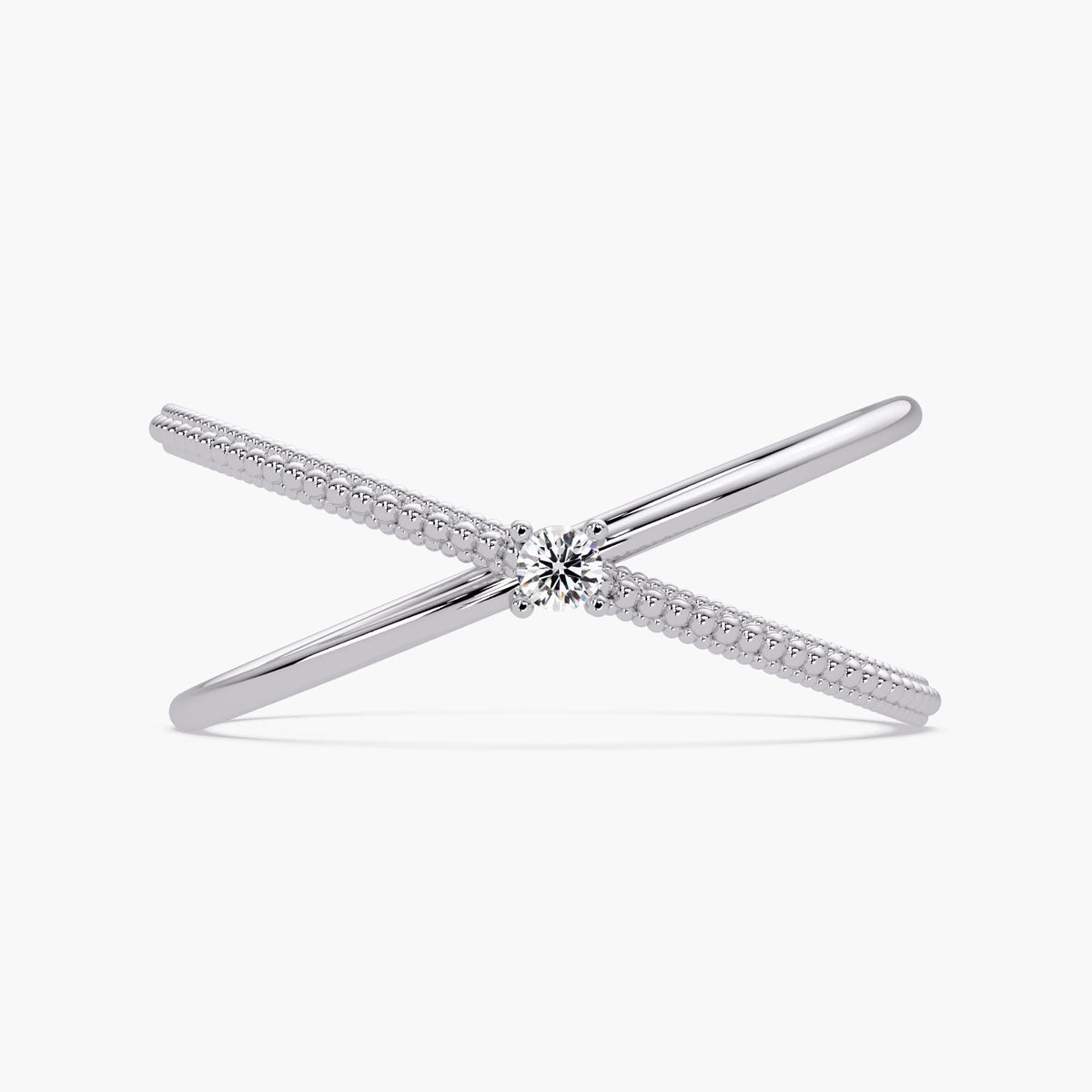 14k white gold criss cross ring featuring a round natural diamond at the center, with one polished band crossing over a beaded gold band in an X-ring design.