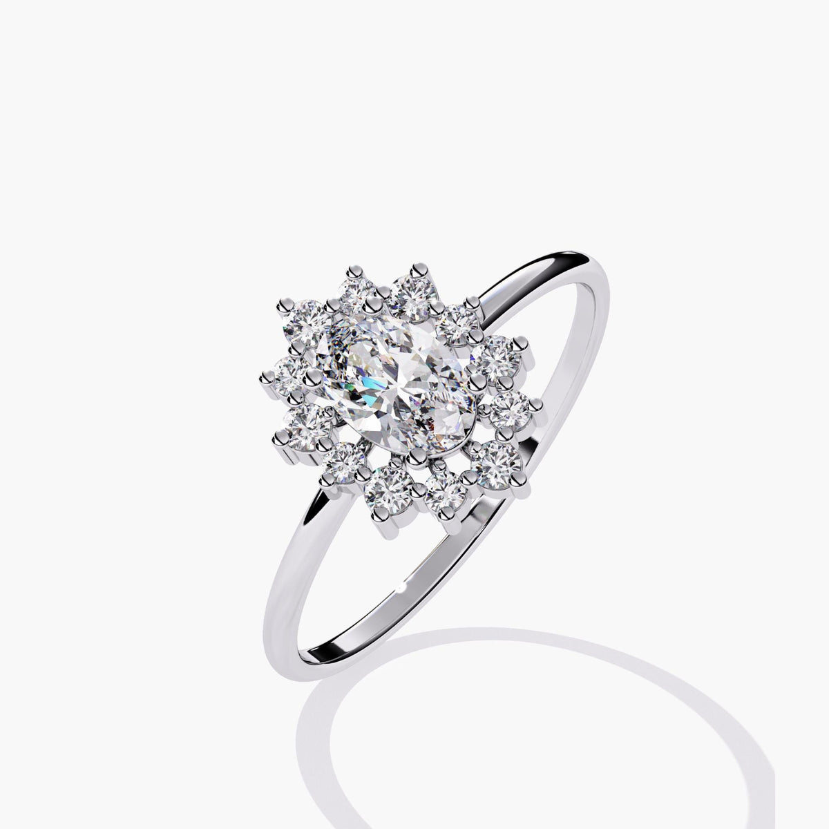 14k white gold ring featuring a 0.5 carat oval lab-grown diamond in a floral halo setting. The starburst halo is composed of small round diamonds on a slim, polished band.