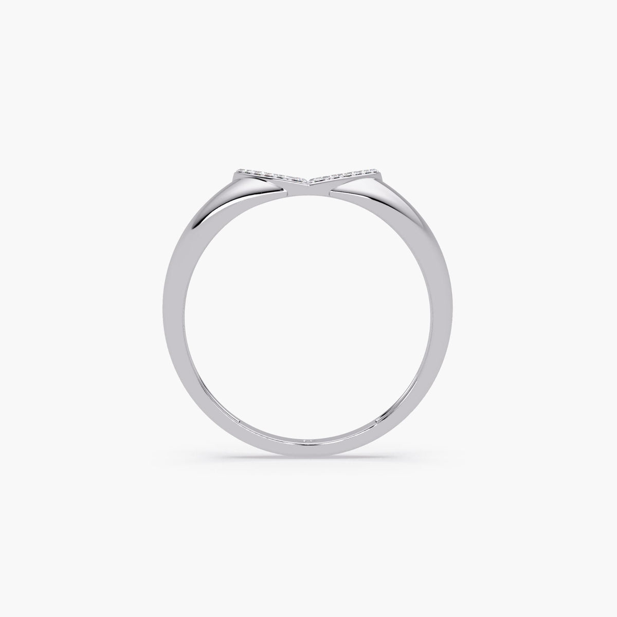 14K white gold ring showing the slim, tapered band and the sculpted underside of the flat heart centerpiece with a V-shaped dip.