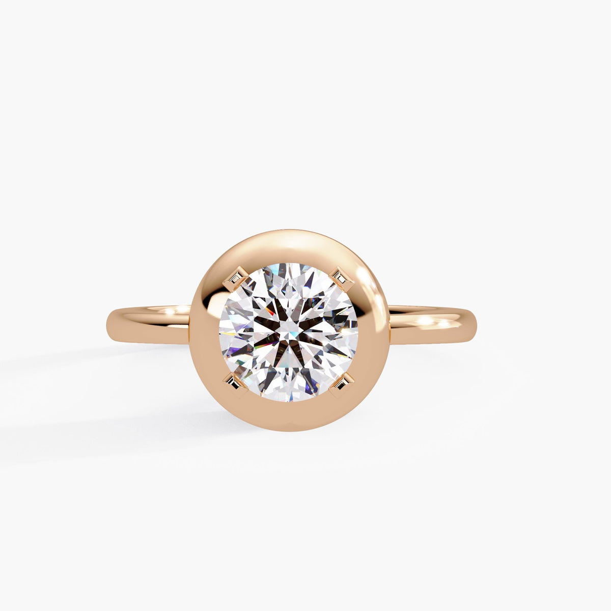 14K rose gold dome button ring with a 1.25 carat round lab-grown diamond in a prong-accented bezel-inspired setting