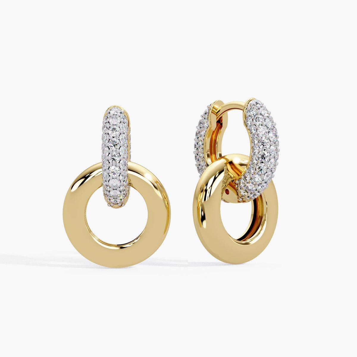 14K gold interlocking circle earrings with a two-part design. The top hoop is a chunky huggie set with round brilliant lab-grown diamonds in a pavé setting. Attached is a smooth, high-polish gold open circle that adds bold shine. The earrings have a two-tone look and a convertible double hoop style. These chunky 14kt dangle earrings are perfect as a wedding or anniversary gift.