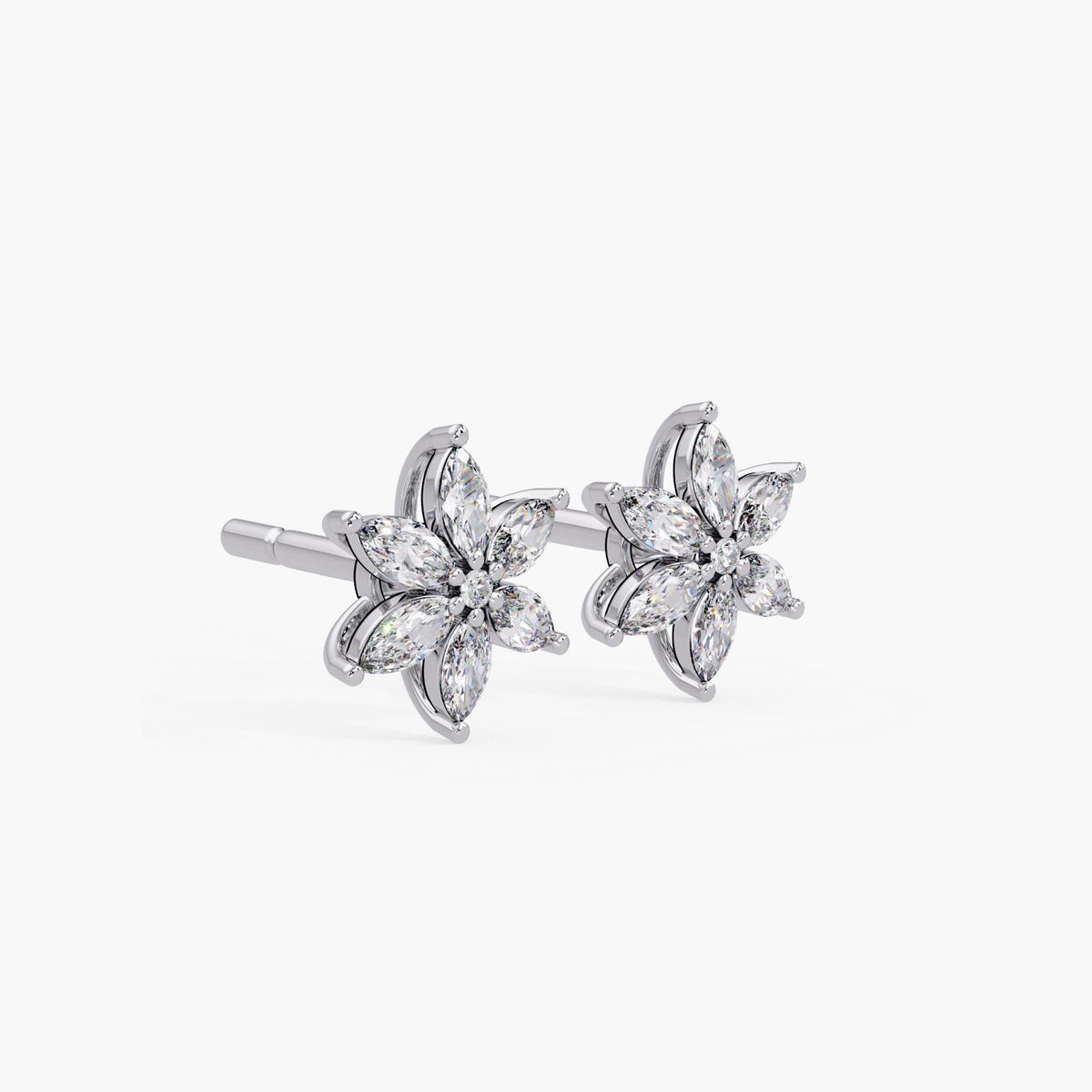 Angled view of white gold marquise diamond flower stud earrings with six marquise-cut diamonds and a round center stone, featuring a secure push-back post and elegant curved setting