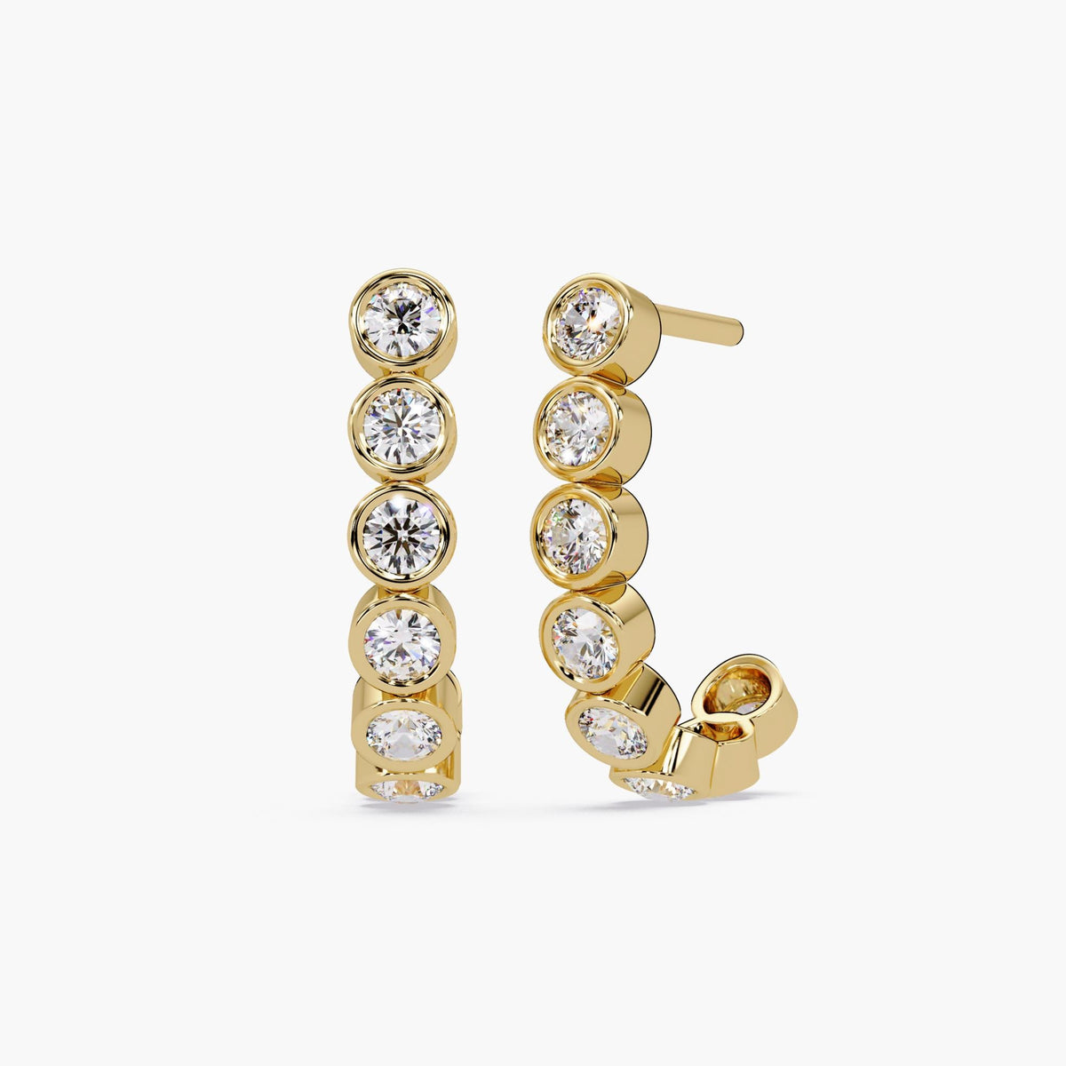 14K yellow gold J-hoop earrings featuring five bezel-set round cut diamonds arranged in a curved vertical row. The earrings are photographed on a white background, highlighting the modern minimalist design and brilliant sparkle. Ideal for everyday wear or gifting.