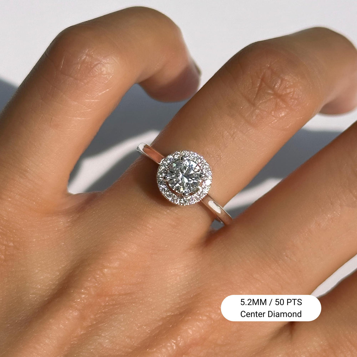 18K White Gold Halo Diamond Ring featuring a 5.2MM Round Lab-Grown Center Diamond (0.50ct) in a pavé halo setting, worn on finger. Designed with a slim, polished straight shank for a minimalist and timeless look — perfect as a promise or engagement ring.