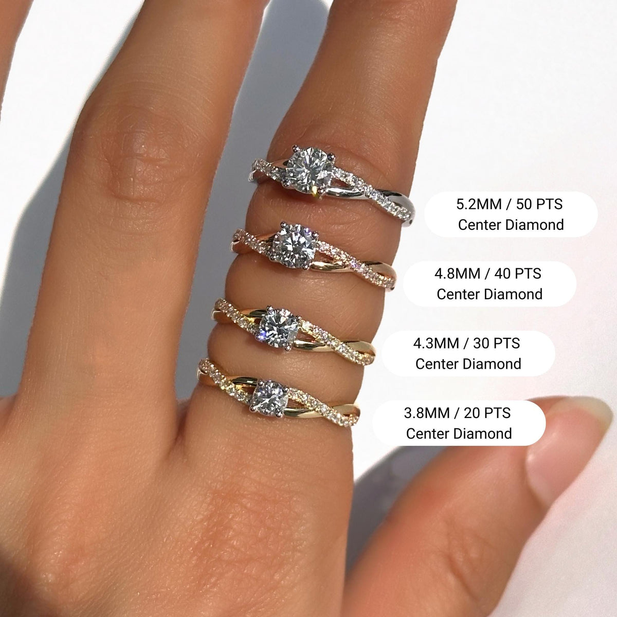 Hand displaying four diamond engagement rings with twisted pavé bands in various gold finishes: white, rose, and yellow gold. The rings feature round center diamonds in four sizes labeled clearly as 3.8mm (20 pts), 4.3mm (30 pts), 4.8mm (40 pts), and 5.2mm (50 pts). Ideal for showcasing diamond size comparisons and ring styles for engagement or milestone gifts.