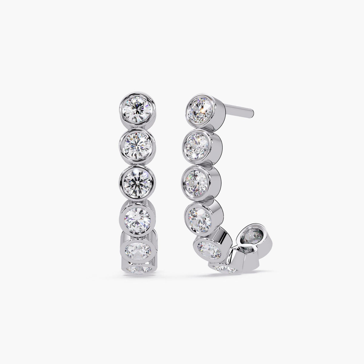 14K White gold J-hoop earrings with bezel-set round diamonds in a curved silhouette. Each earring features lab-grown diamonds with brilliant sparkle in a sleek 14K white gold finish.