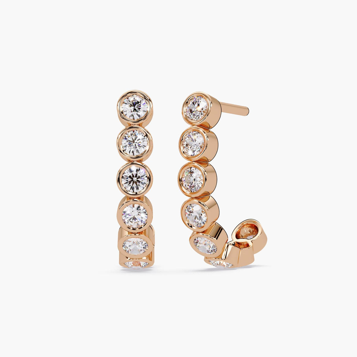 14K rose gold J-hoop earrings featuring bezel-set round lab-grown diamonds. A refined, feminine classic diamond hoops