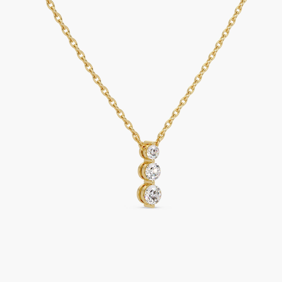 14K yellow gold necklace with three round lab-grown diamonds in prong setting vertical drop pendant on a fine cable chain