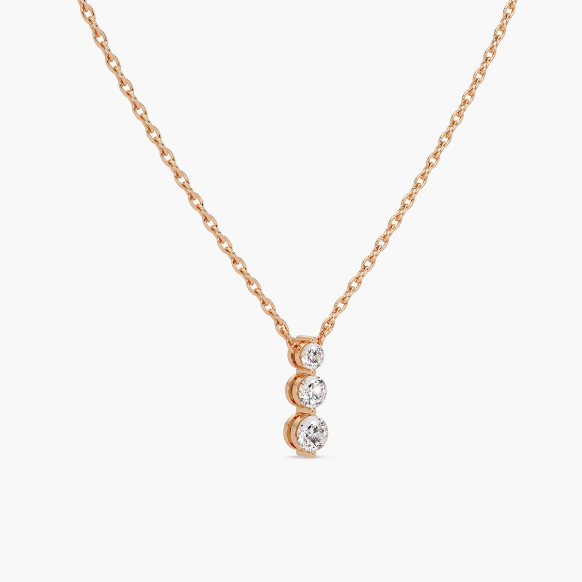 rose gold diamond pendant necklace with prong-set lab-grown diamonds in a vertical trio design
