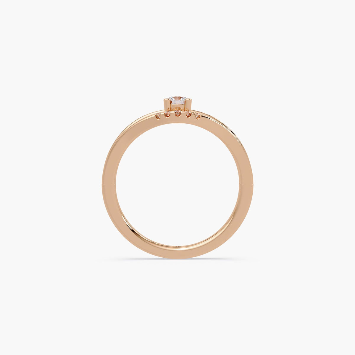 14K rose gold chevron ring with a 0.15 carat round lab-grown diamond solitaire in a four-prong setting and slim curved band.