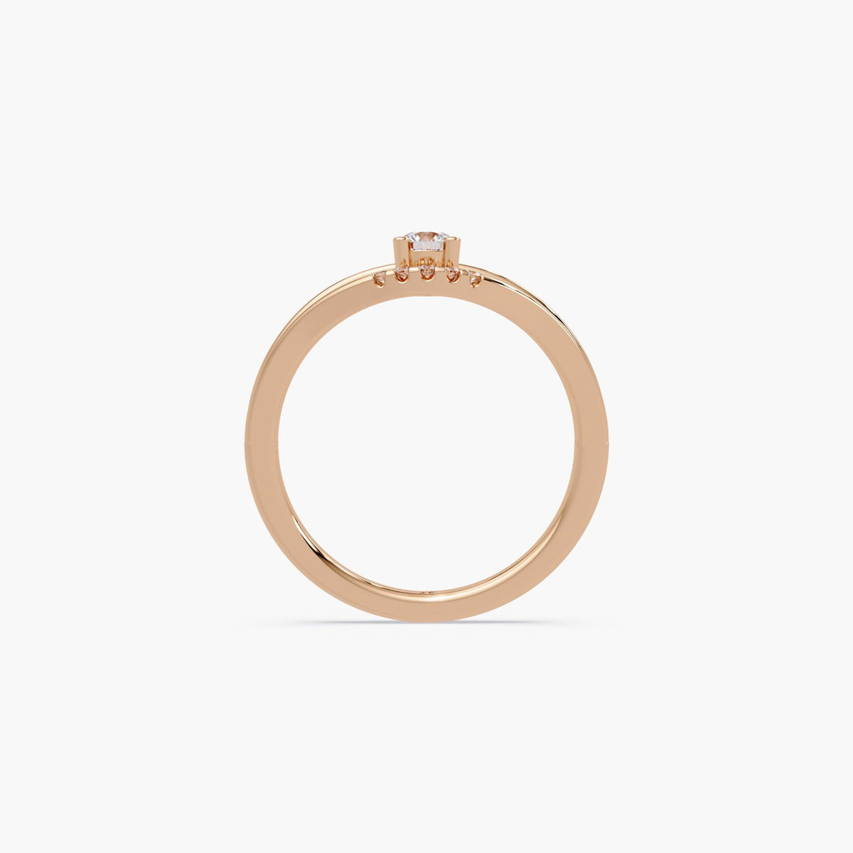 14K rose gold natural diamond ring with a 0.15 carat round natural diamond solitaire in a four-prong setting and slim curved band.