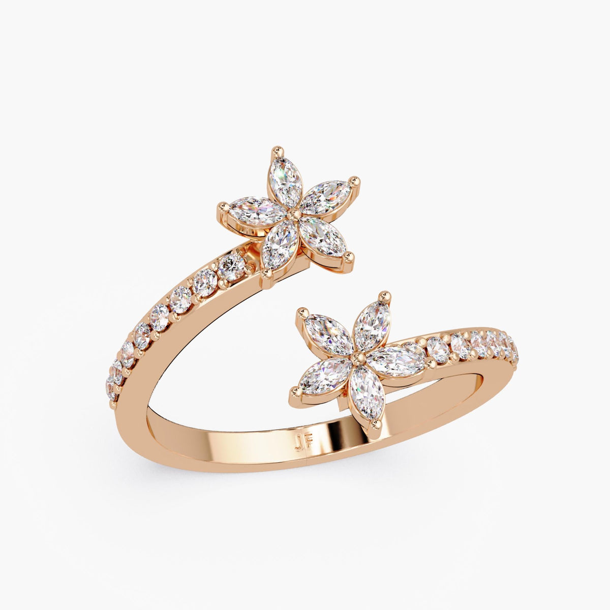 Floral diamond ring in solid gold featuring two marquise-cut blossoms across a bypass wrap design.