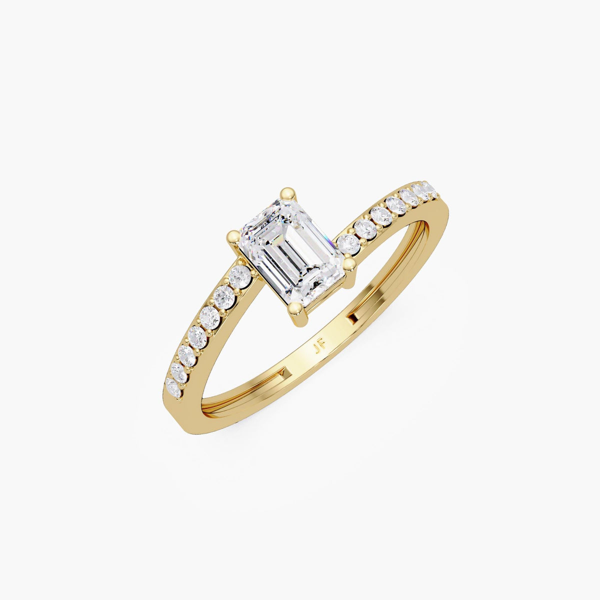 emerald cut solitaire engagement ring, 0.50 ct lab grown diamond in 14K yellow gold with pavé band and four prong setting.