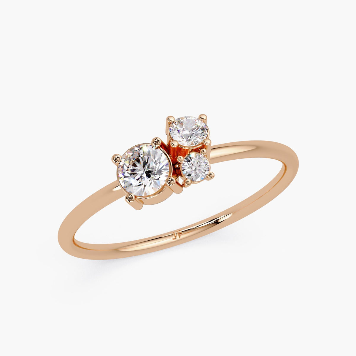 14k rose gold three-stone lab diamond ring with round brilliant-cut diamonds in a dainty graduated cluster setting and slim polished band