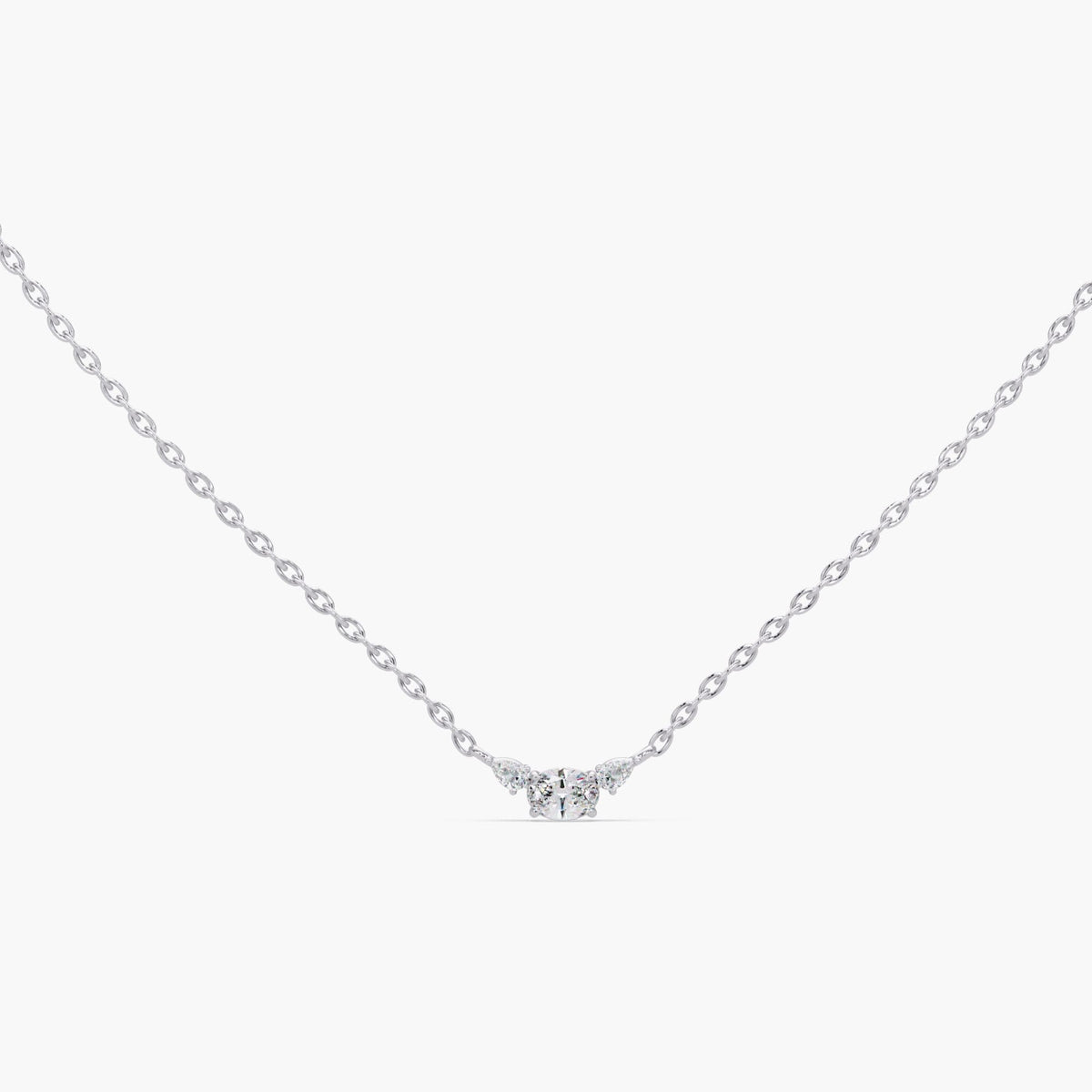 14K white gold three stone necklace with oval lab-grown diamond center and pear side diamonds, dainty minimalist pendant on adjustable chain, elegant diamond jewelry perfect for bridal wear, wedding necklace, or meaningful anniversary gift for her.