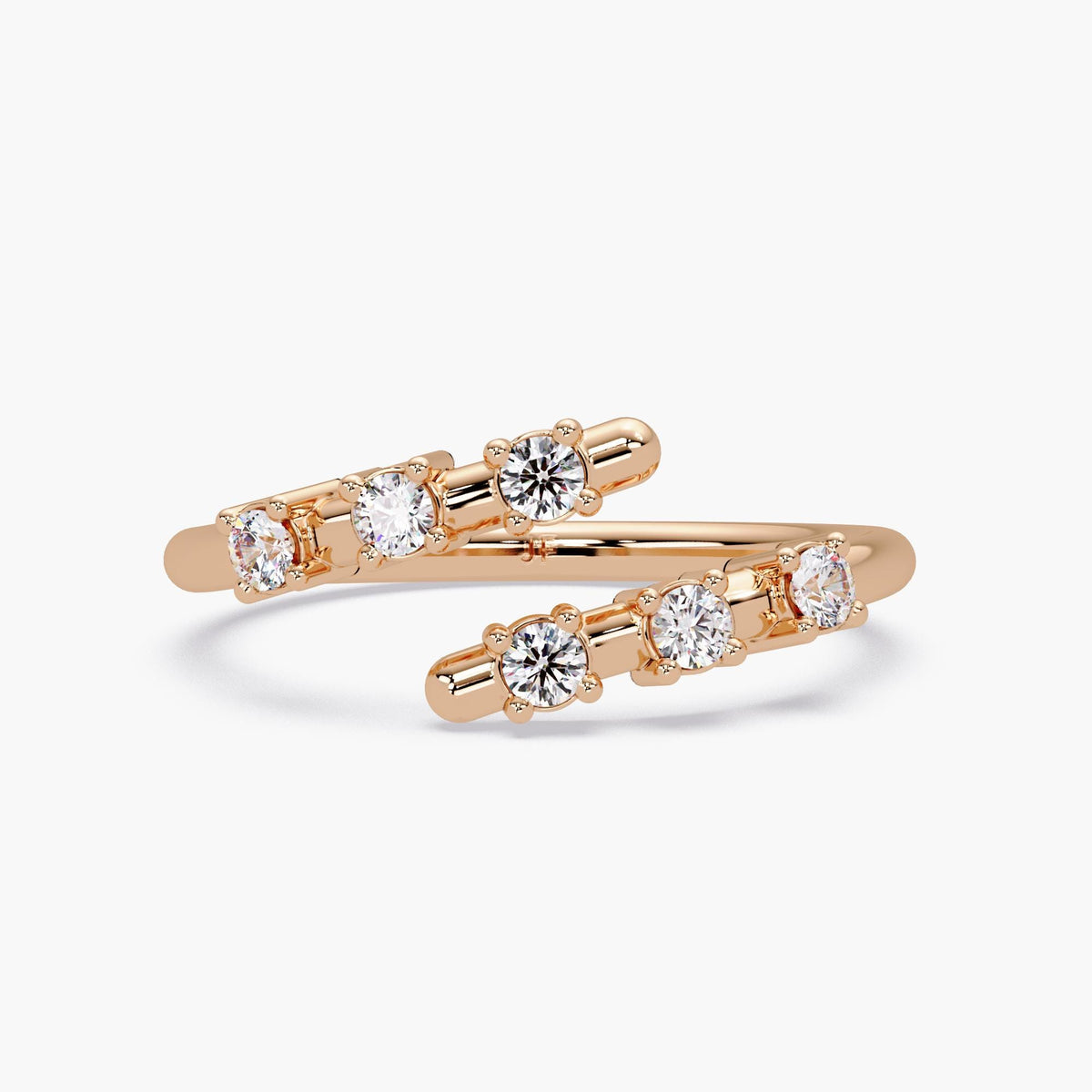 open wrap ring crafted in 14K rose gold, featuring two rows of round lab-grown diamonds totaling 0.20 carats. The floating double band silhouette and warm blush tone make it a modern statement piece for stacking, pinky wear, or gifting.