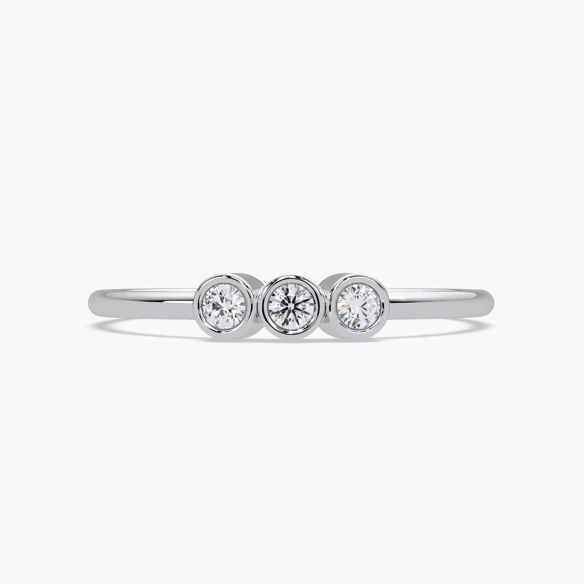 14k gold three stone diamond ring with bezel set natural diamonds.