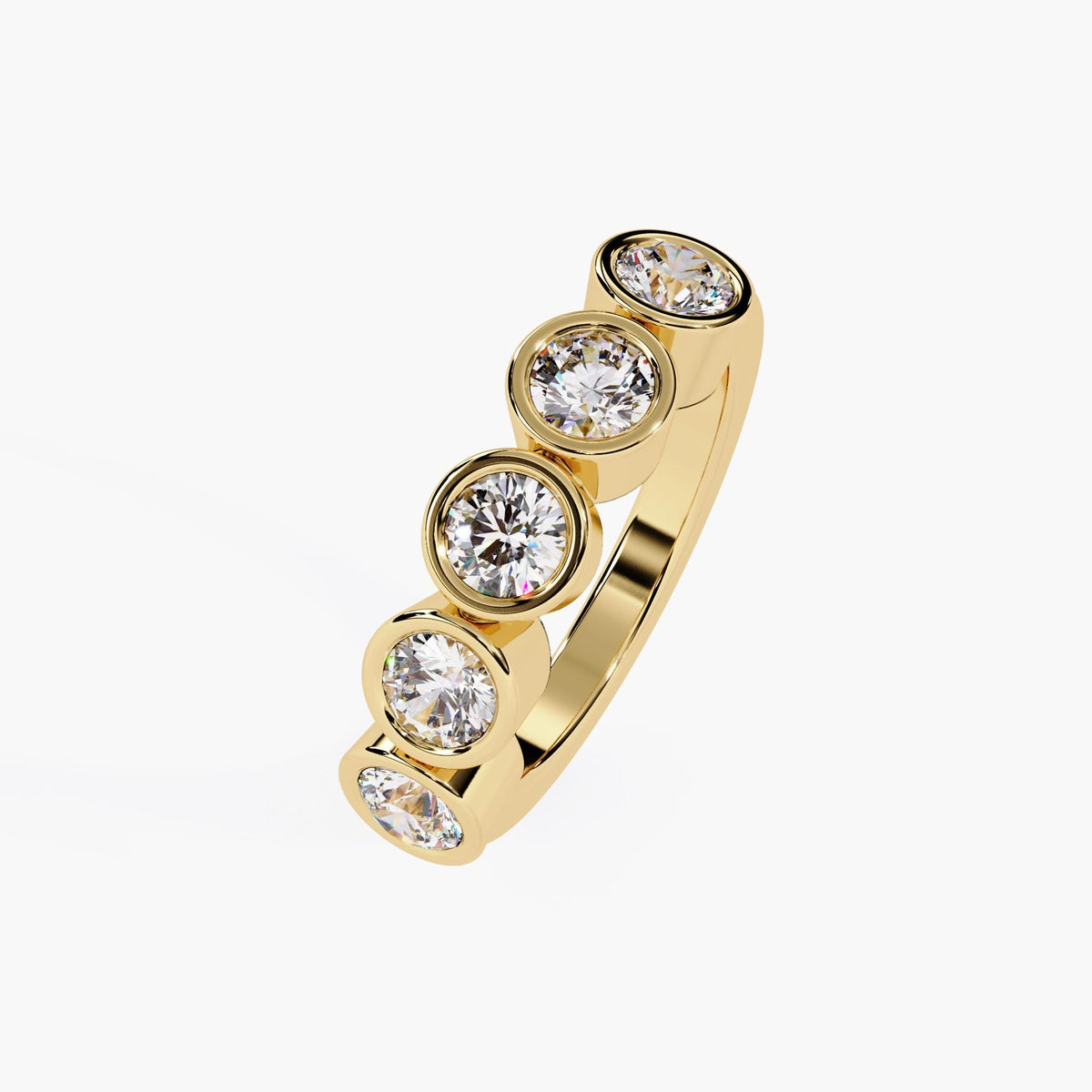 bezel diamond five-stone ring in yellow gold.
