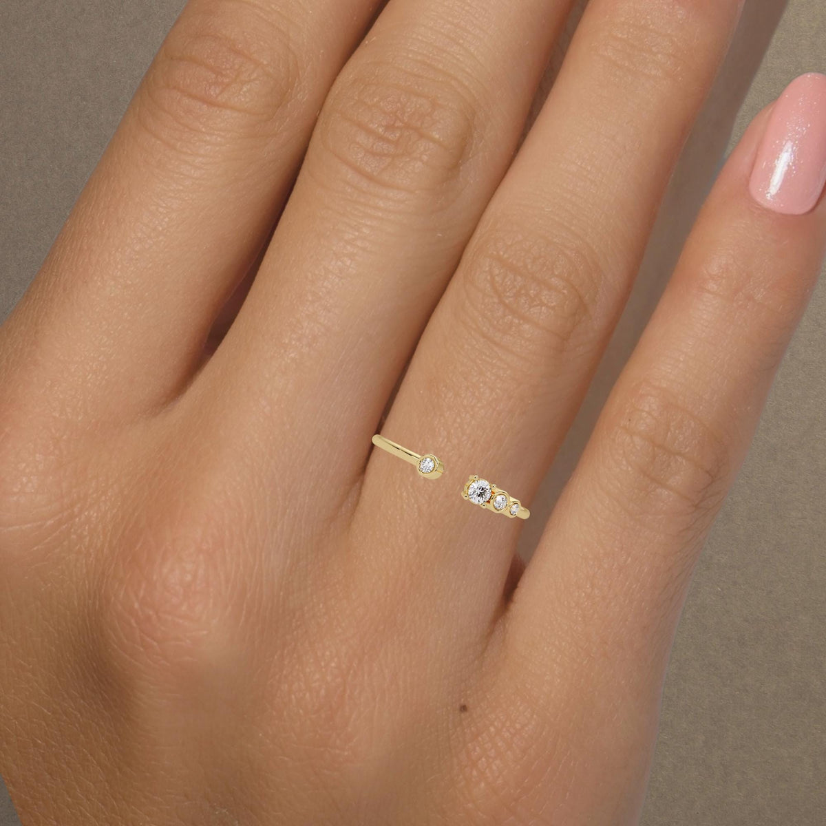 Minimalist stacking band in 14k gold with dainty diamonds