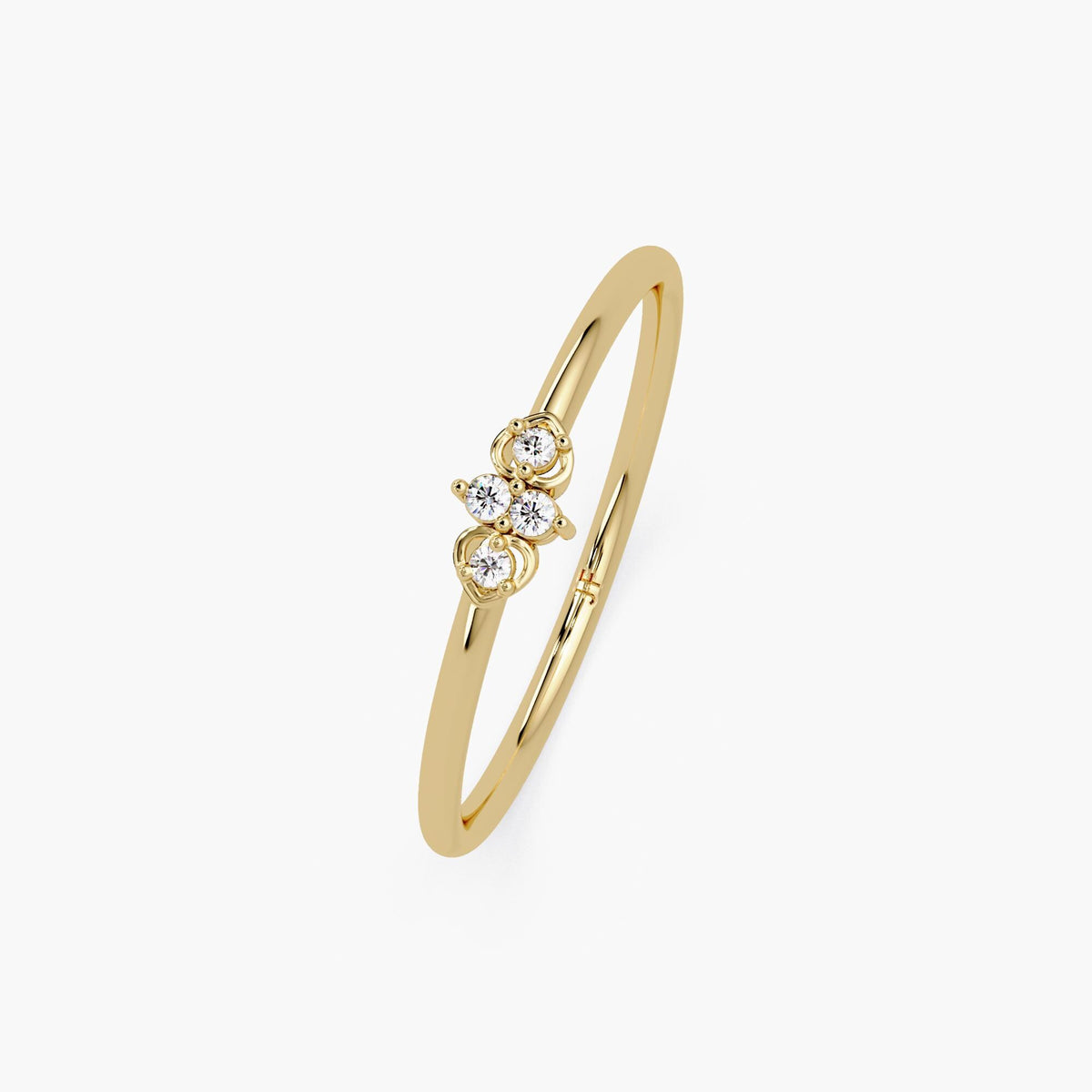 Four-stone diamond ring in a heart-inspired design on a plain background.
