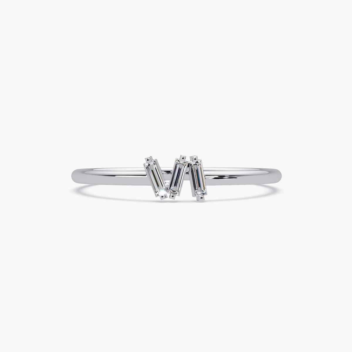 Minimalist baguette diamond ring with slim white gold band.