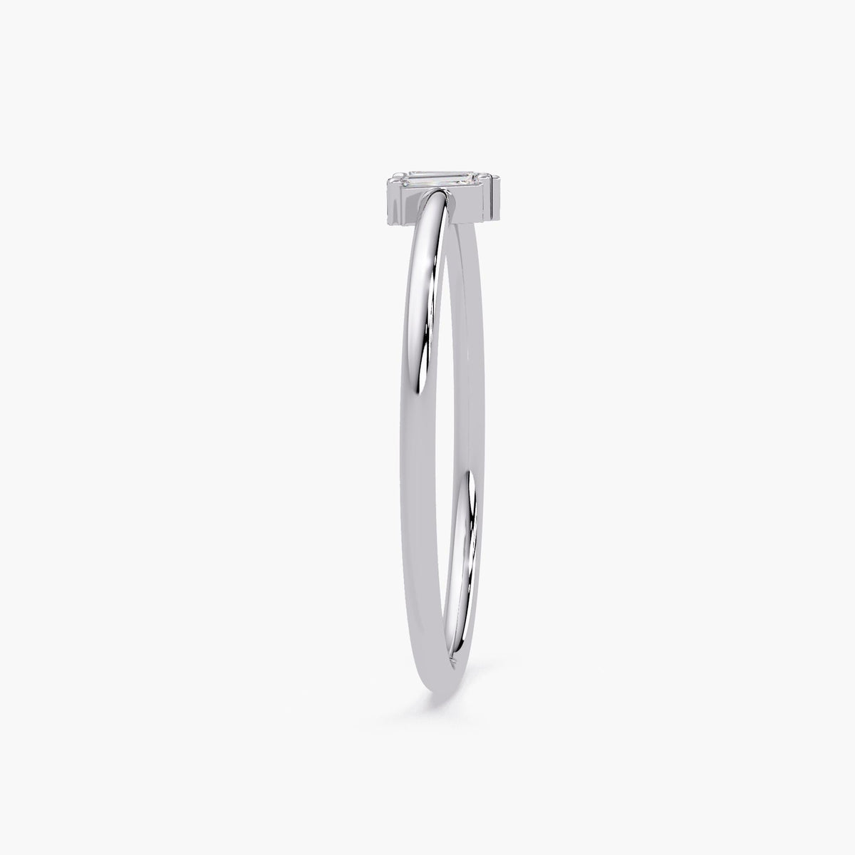 Thin 14k gold baguette diamond ring with minimalist style.