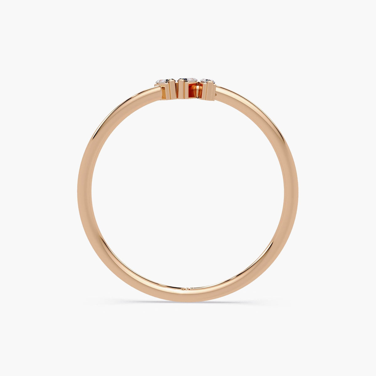Elegant baguette diamond trio ring for stacking or solo wear.