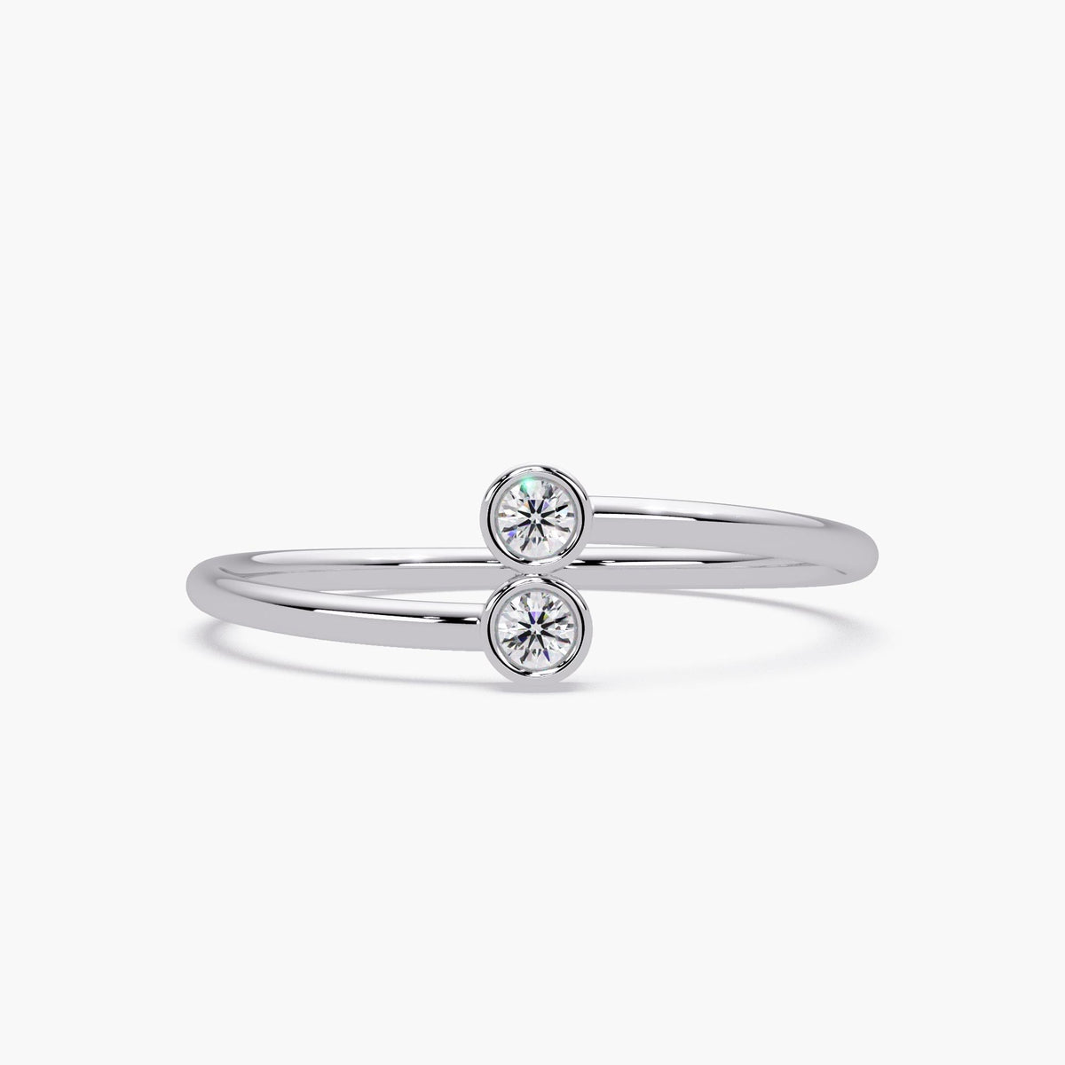 14k white gold bypass ring with two bezel set natural diamonds.