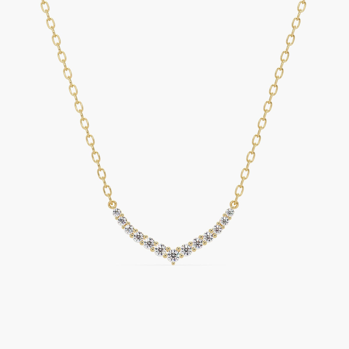 14k gold V-shaped chevron necklace with round diamonds set in a curved bar pattern. The necklace features a delicate gold chain and a symmetrical diamond layout, forming a soft point at the center.