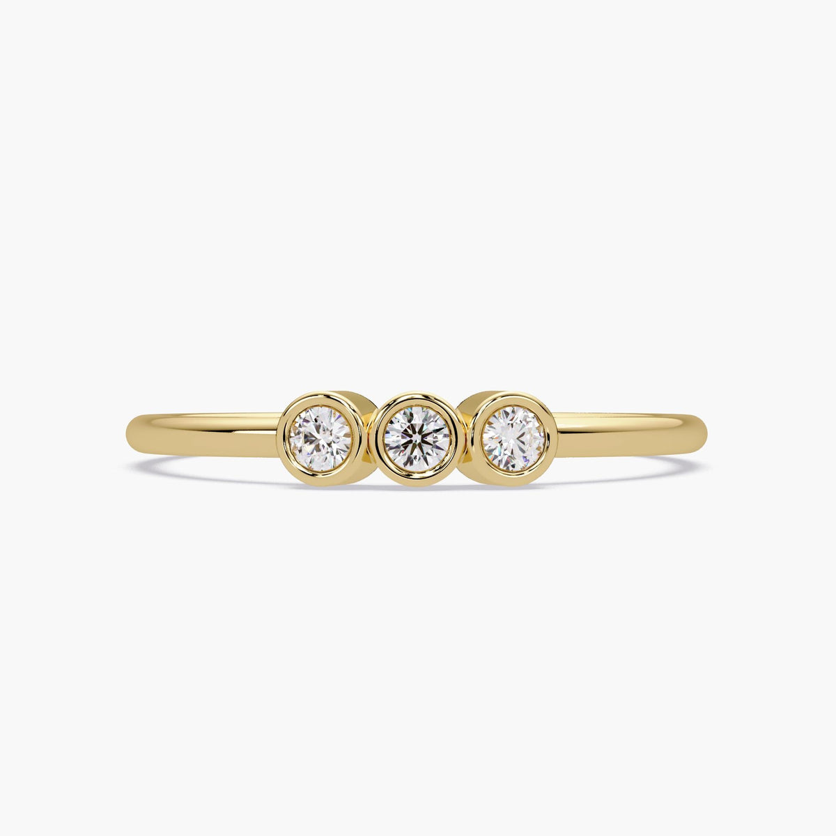 14k gold three stone diamond ring with bezel set natural diamonds.