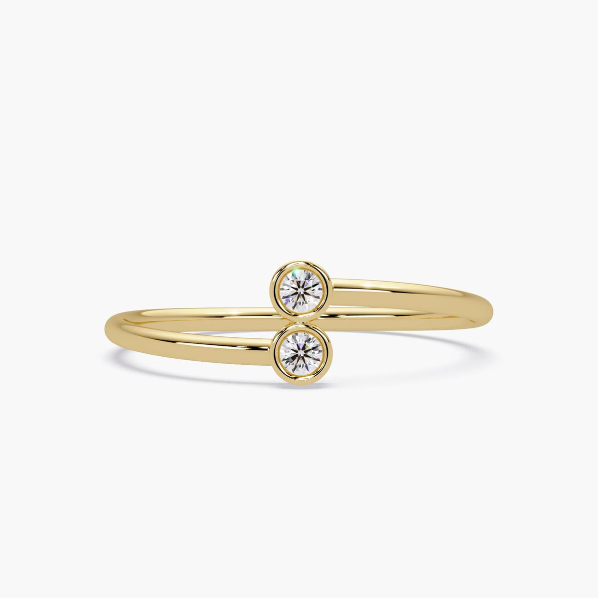 14k gold bypass ring with two bezel set natural diamonds.