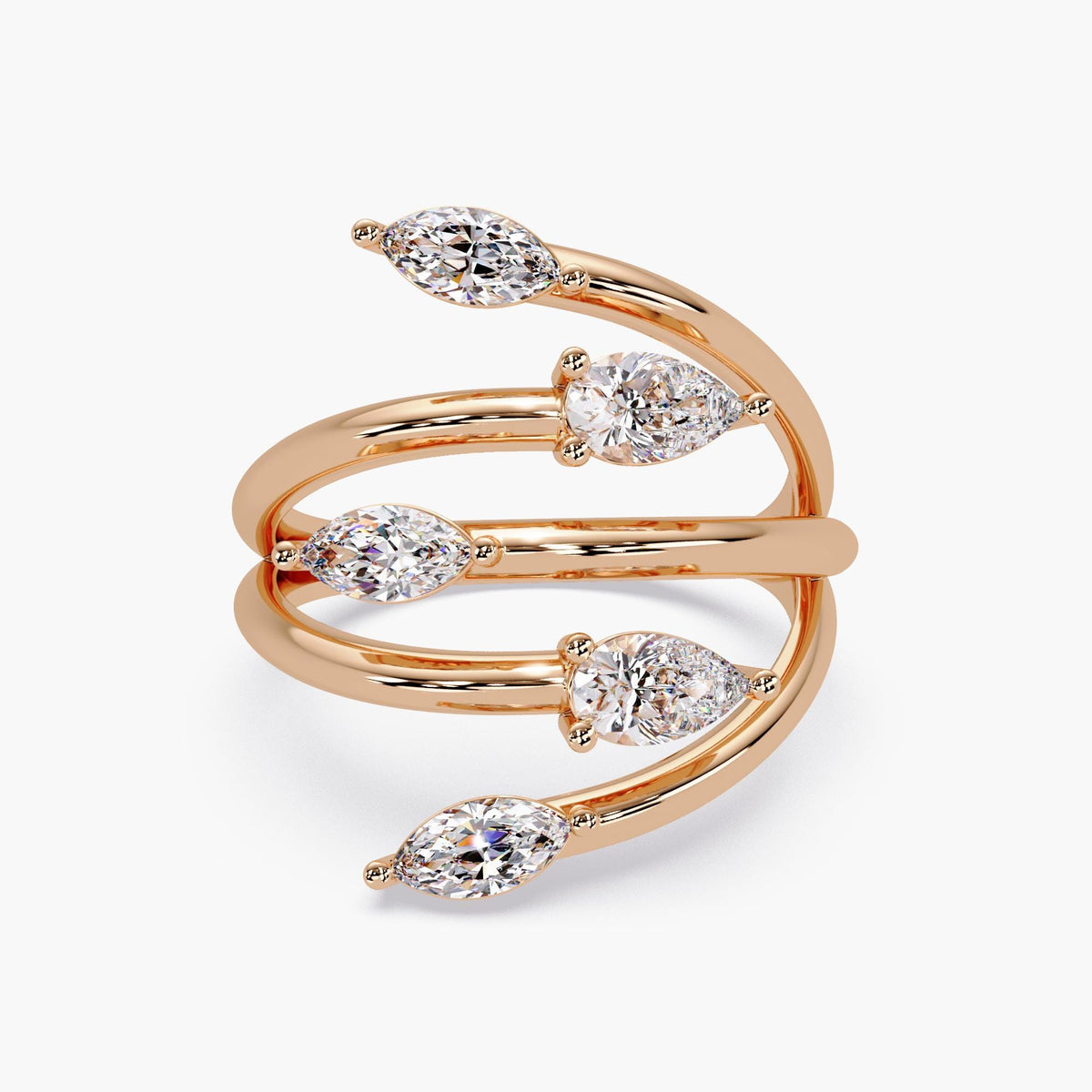 Modern gold statement ring featuring alternating marquise and pear diamonds.