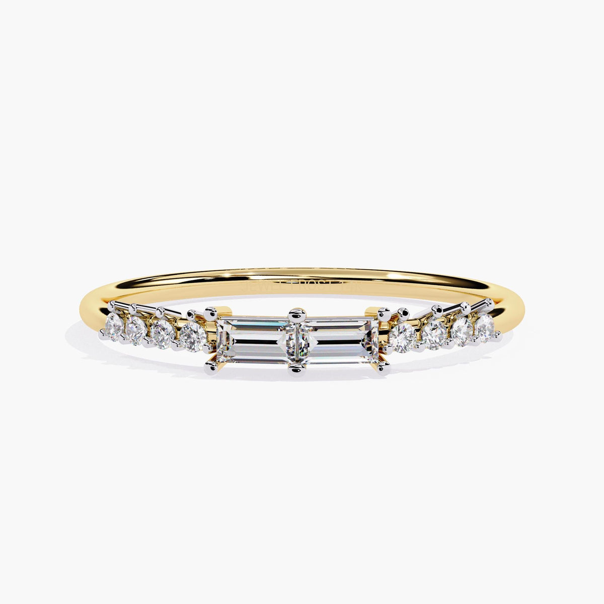 A yellow gold band ring with a baguette diamond and smaller round diamonds on the band.