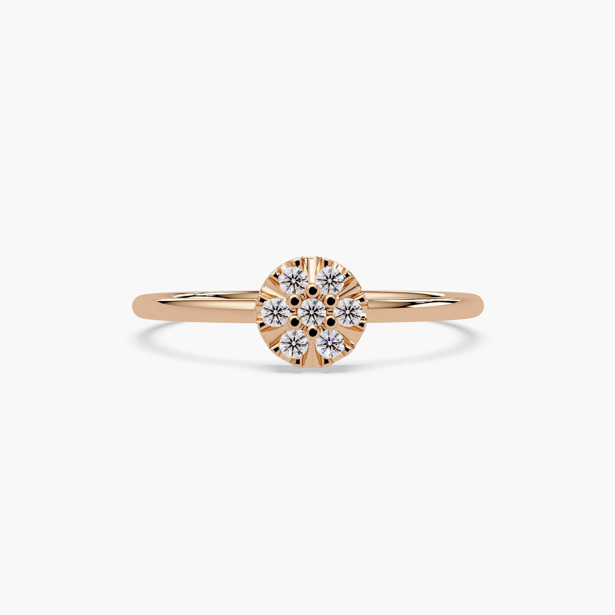 Elegant stacking ring in 14k gold with a flower-shaped diamond cluster.