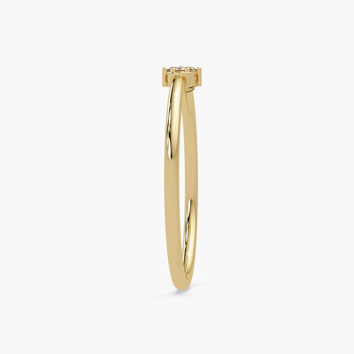 Side view of the slim 1.3mm gold band with heart-shaped diamond setting.